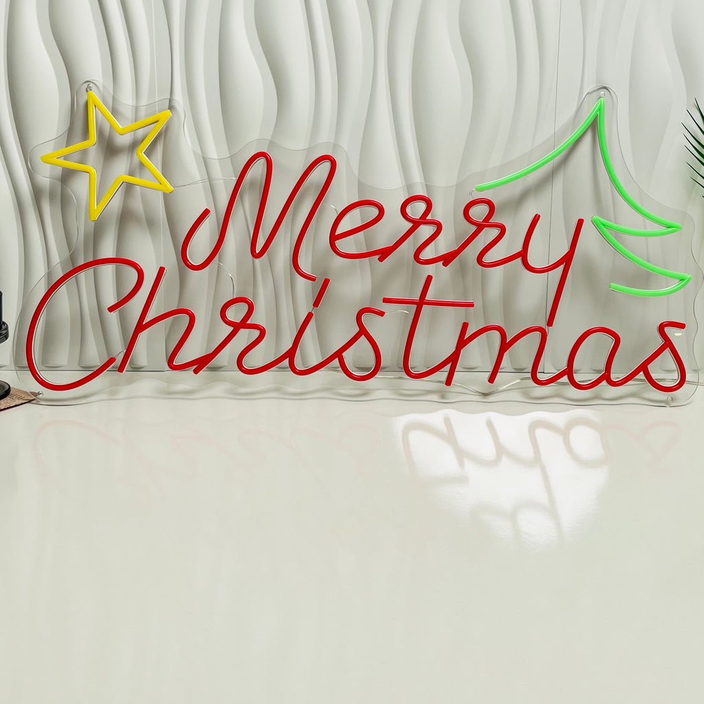 Neon sign with 'Merry Christmas' on a textured white wall.